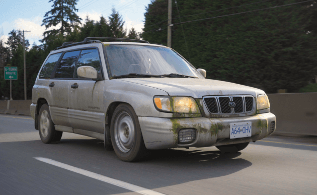 Moss-streaked 2001 Subaru Forester back out on the highway.